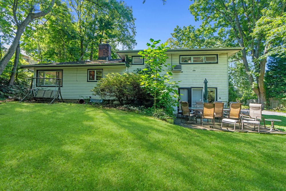Back of the house, patio and yard at 58 Ridge Dr. E