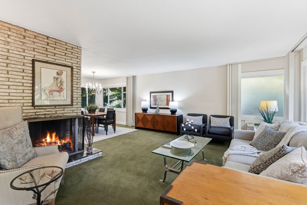 Living room with brick fireplace at 58 Ridge Dr. E
