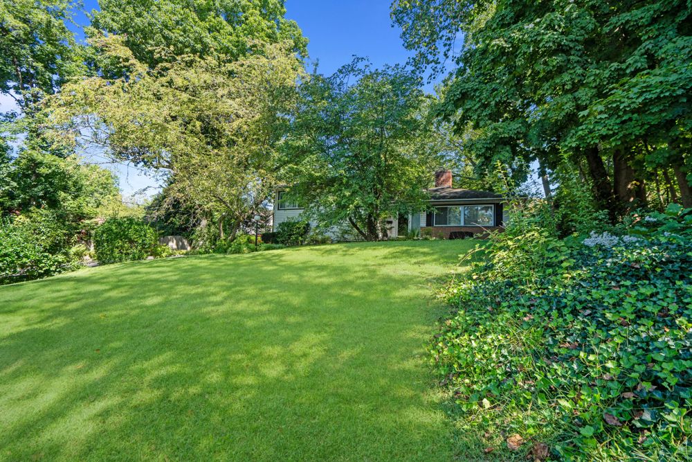 Front lawn and mature trees at 58 Ridge Dr. E